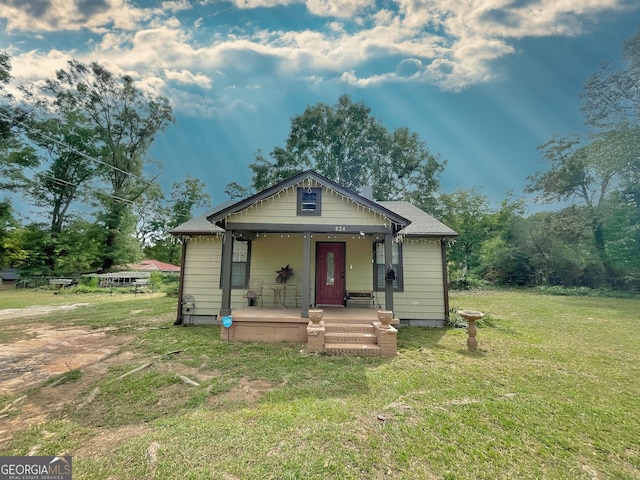 bungalow featuring a porch and a front yard