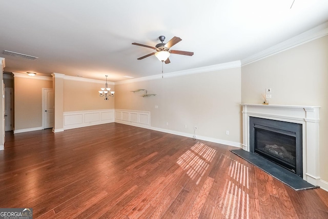 unfurnished living room featuring ornamental molding, dark hardwood / wood-style floors, and ceiling fan with notable chandelier