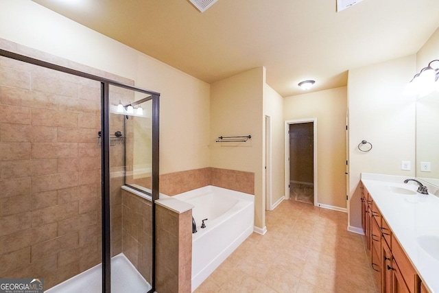 bathroom with vanity and separate shower and tub