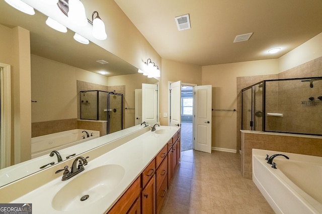 bathroom with tile patterned flooring, vanity, and shower with separate bathtub