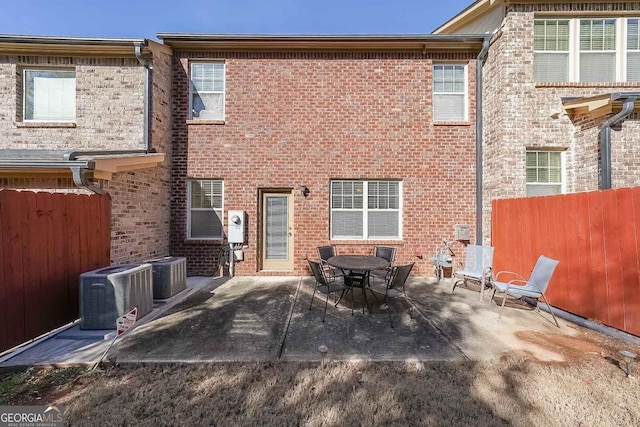 back of house with cooling unit and a patio area