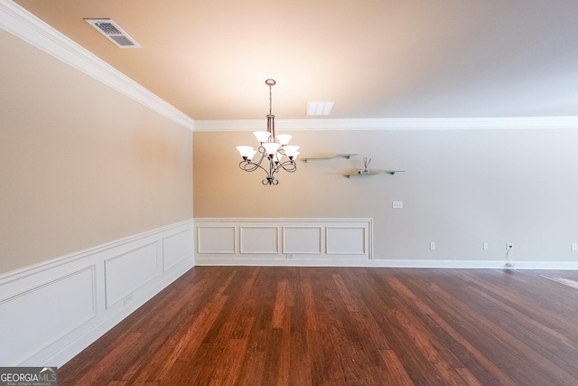 unfurnished dining area with ornamental molding, dark hardwood / wood-style floors, and an inviting chandelier