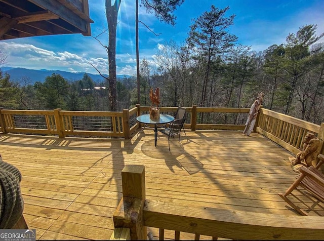 wooden terrace with a mountain view