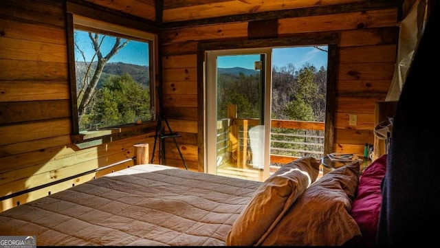 170 Community Hill Dr Unit 54, Blue Ridge, GA 30513 - bedroom with wood walls, multiple windows, and a mountain view