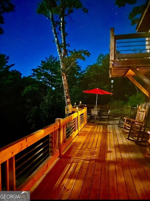 view of deck at twilight