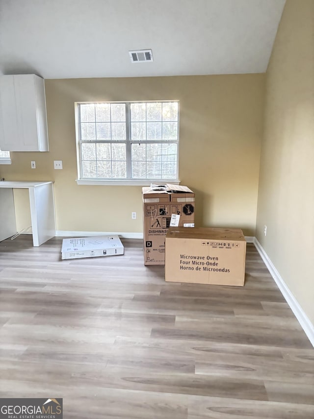 interior space with hardwood / wood-style floors