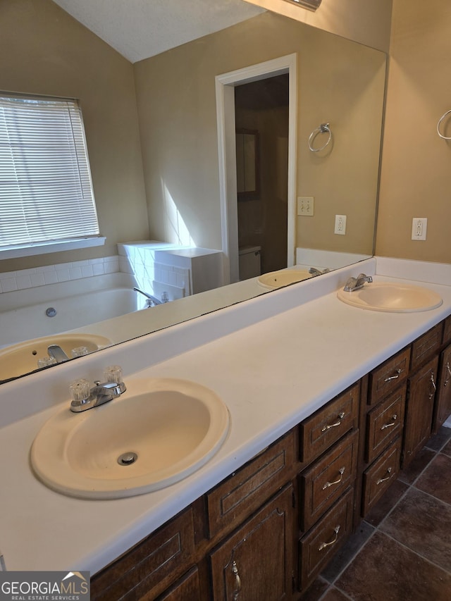 bathroom featuring vanity and a tub to relax in