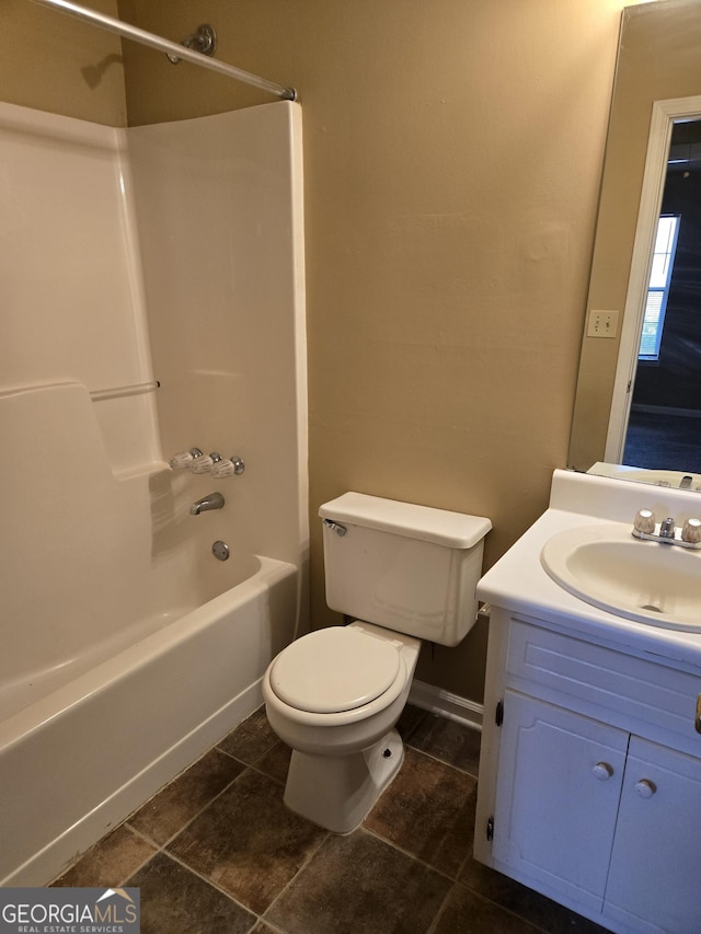 full bathroom with washtub / shower combination, vanity, and toilet