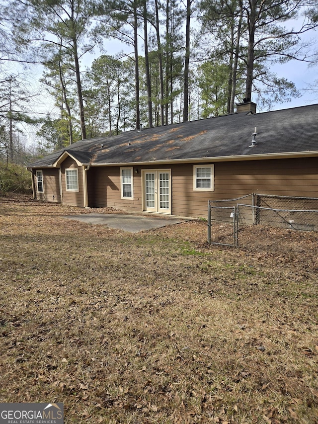 back of house with french doors and a patio area