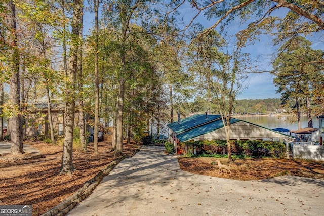 view of home's community with a water view