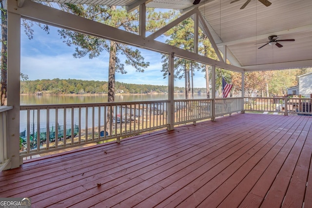 wooden deck featuring a water view and ceiling fan