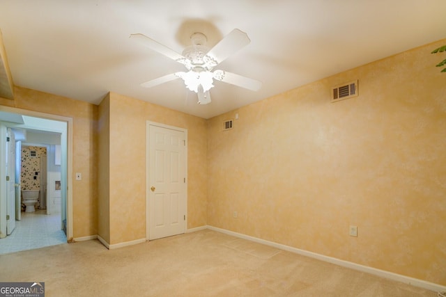 unfurnished bedroom with carpet floors and ceiling fan