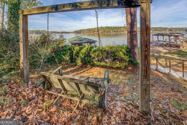 view of yard featuring a water view and a gazebo