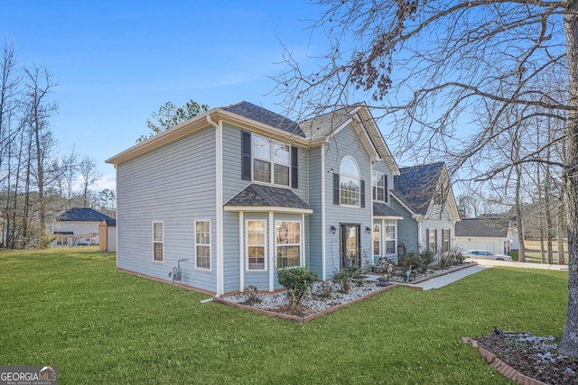 view of side of property with a yard