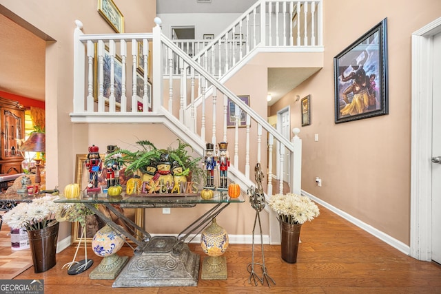 staircase featuring hardwood / wood-style flooring