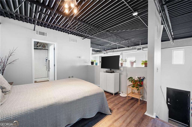 bedroom featuring hardwood / wood-style flooring