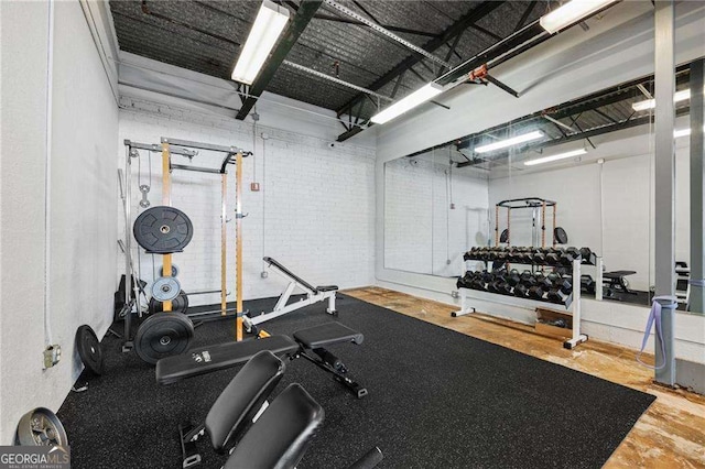 exercise area with brick wall