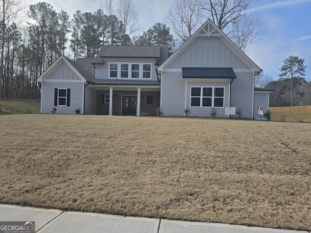 back of property with a lawn