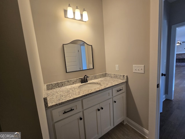 bathroom with vanity and hardwood / wood-style flooring