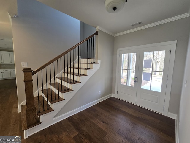 interior space featuring dark hardwood / wood-style flooring, crown molding, and french doors