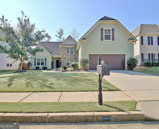 front of property featuring a garage and a front yard