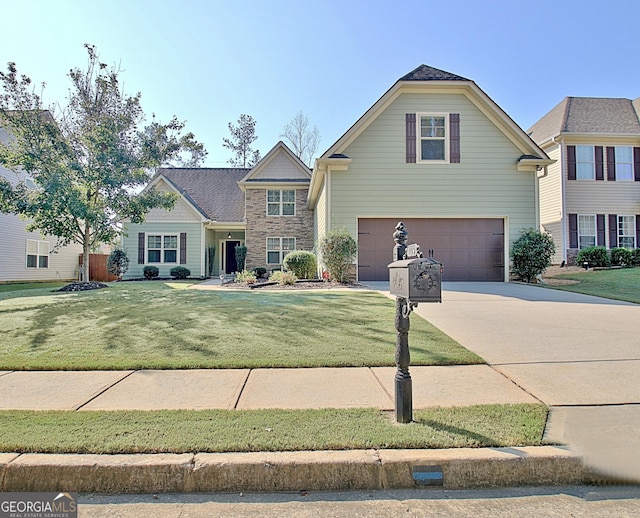 front of property featuring a garage and a front yard