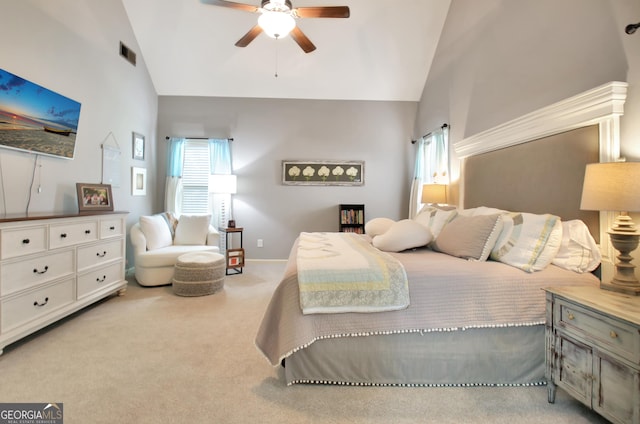 bedroom featuring high vaulted ceiling, light colored carpet, and ceiling fan