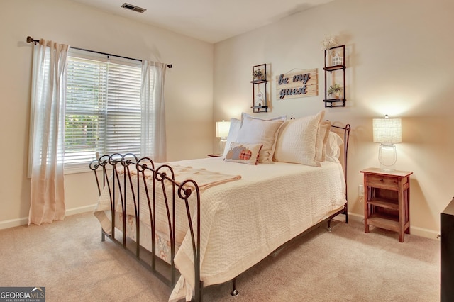 bedroom with light carpet