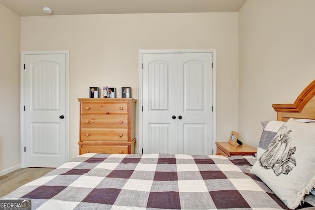 bedroom with carpet floors and a closet