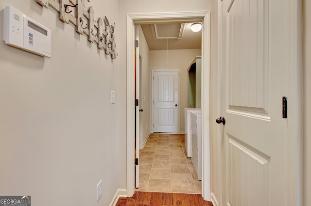 corridor with independent washer and dryer