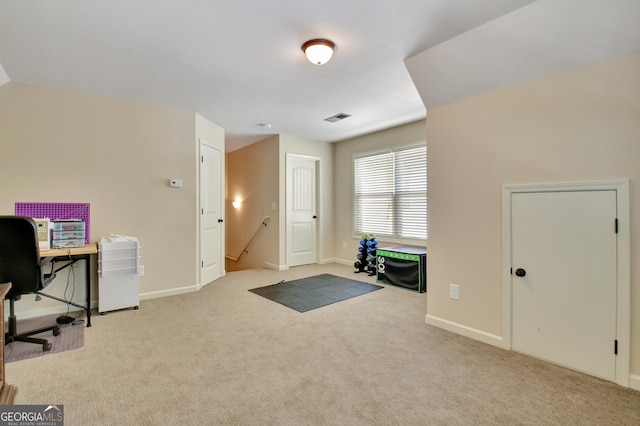 office space with light colored carpet