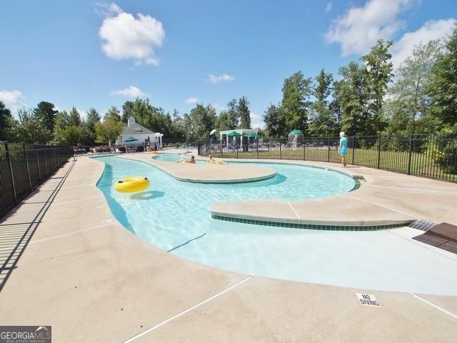 view of property's community with a patio and a swimming pool