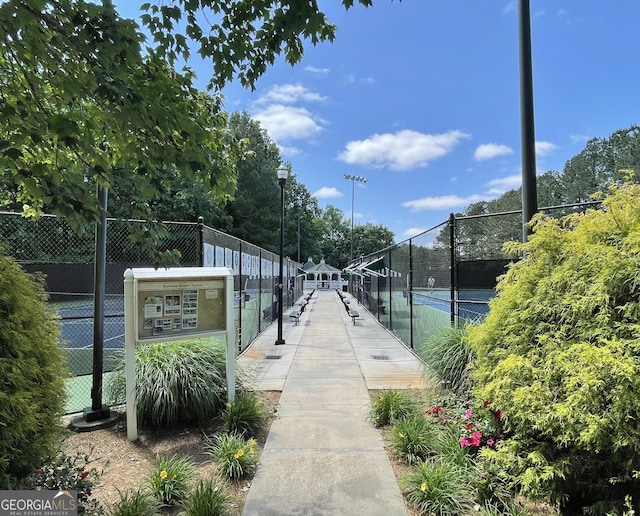 view of community with tennis court