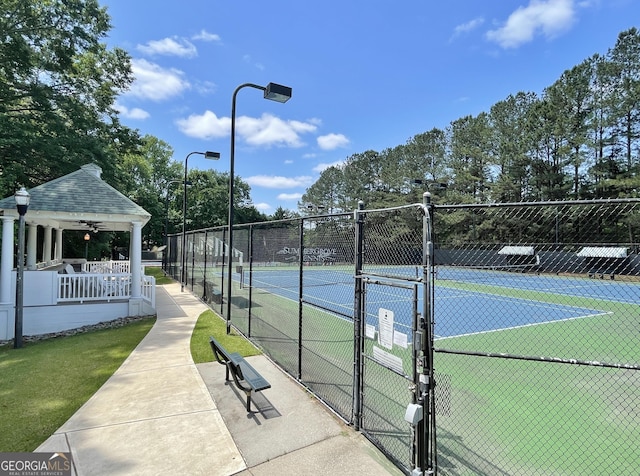 view of tennis court with ceiling fan