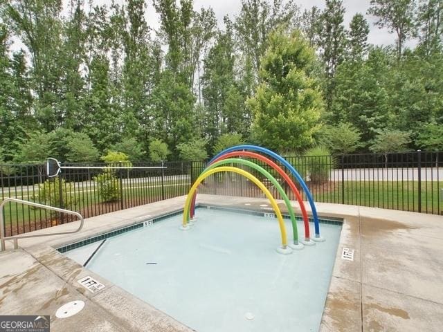 view of pool with a playground