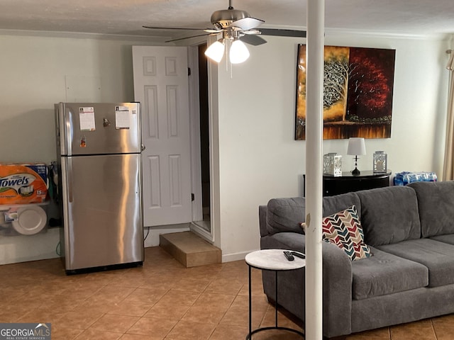 living room featuring ceiling fan and light tile patterned floors