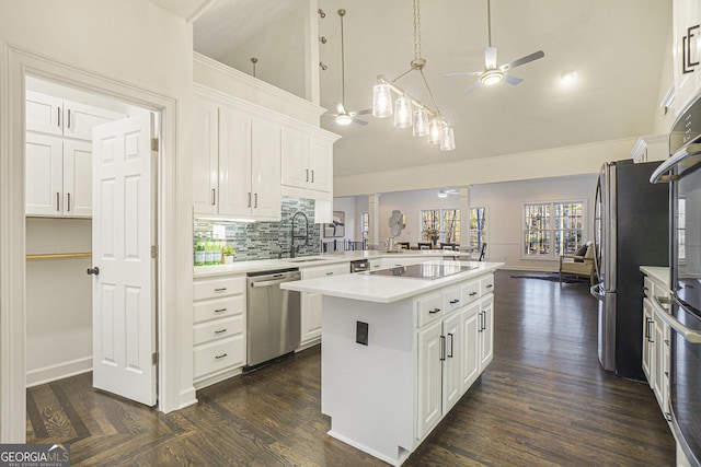 kitchen with high vaulted ceiling, a ceiling fan, a sink, dishwasher, and light countertops