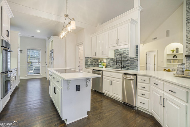 201 Windflower Ct, Canton, GA 30115 - kitchen featuring stainless steel appliances, white cabinets, a kitchen island, light countertops, and recessed lighting