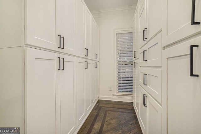 interior space featuring baseboards and ornamental molding