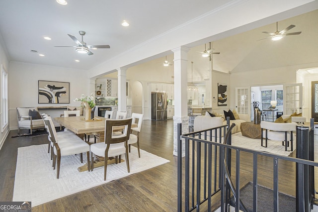 dining room featuring ornate columns, ceiling fan, lofted ceiling, dark wood-type flooring, and recessed lighting