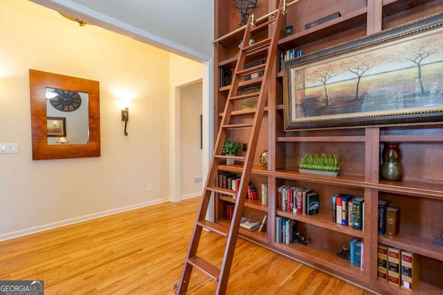 sitting room featuring light wood-style flooring and baseboards