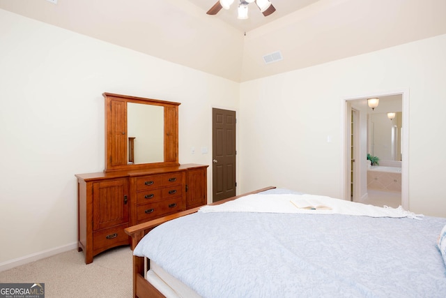 bedroom with ceiling fan, light carpet, visible vents, baseboards, and vaulted ceiling