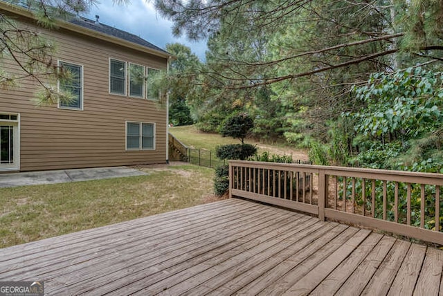 wooden deck with a lawn