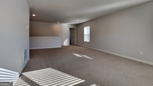 empty room featuring carpet floors