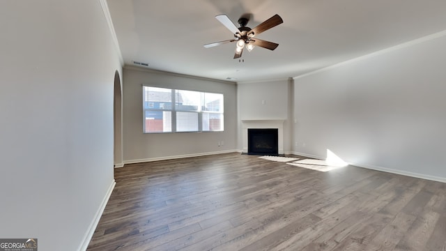 unfurnished living room featuring ornamental molding, hardwood / wood-style floors, and ceiling fan