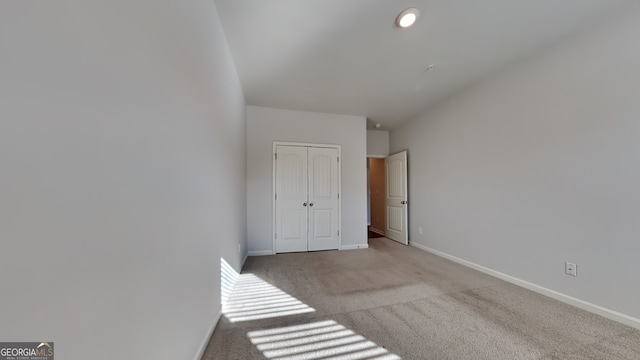 interior space featuring light carpet