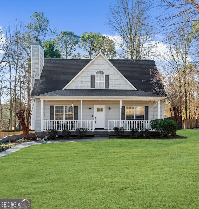 view of front facade featuring covered porch and a front yard