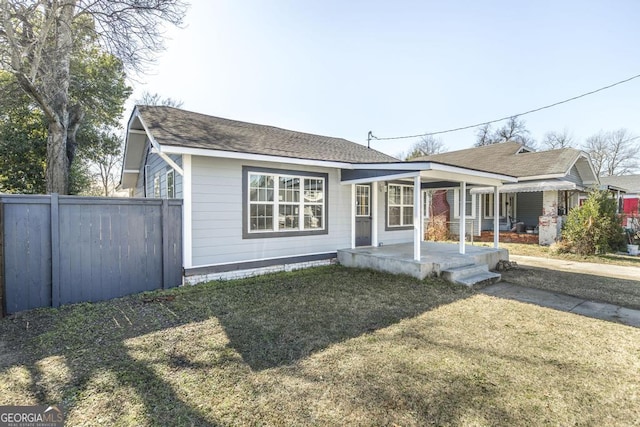 view of front of property with a porch and a front lawn