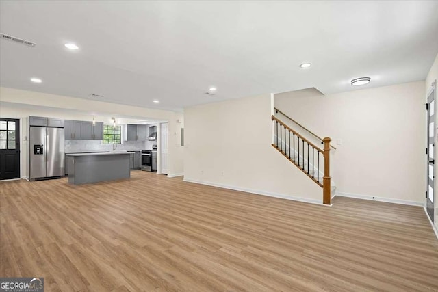 unfurnished living room featuring light hardwood / wood-style floors