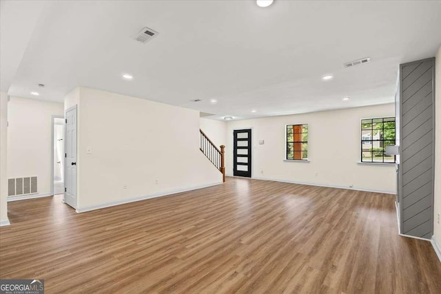 unfurnished living room with light wood-type flooring